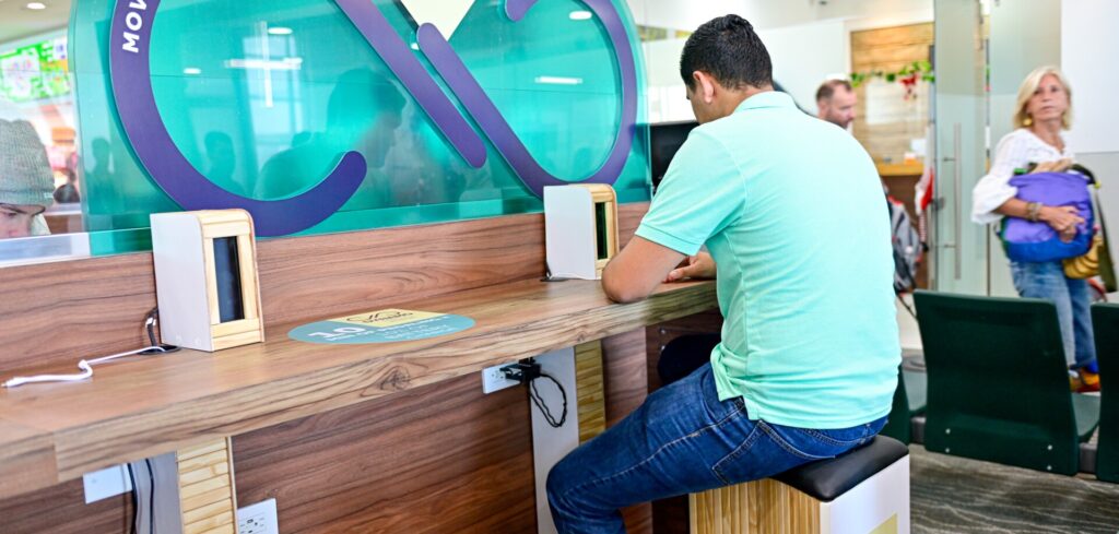 Passengers use pedal stations to charge smart devices at Costa Rican airport