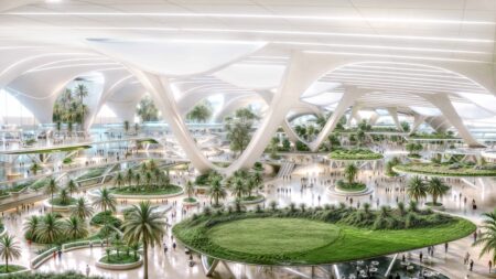 Mohammed bin Rashid approves plans to create ‘world’s largest airport’ in Dubai A render of the future layout of Al Maktoum Airport, with islands of greenery and curved arches and columns.
