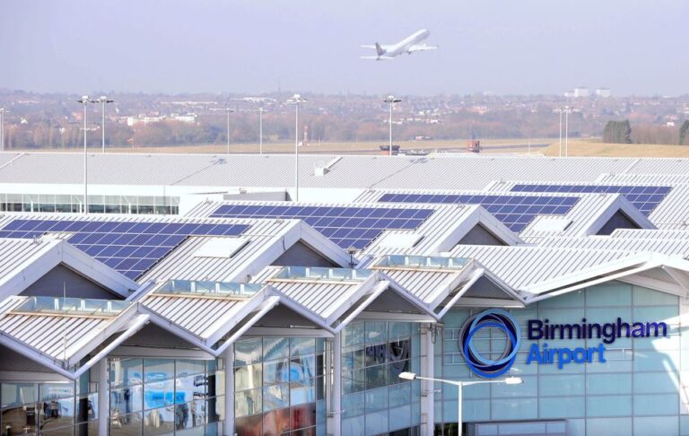 Birmingham Airport announces security area changes A view of Birmingham Airport's roofs and solar panels with a plane taking off in the background.