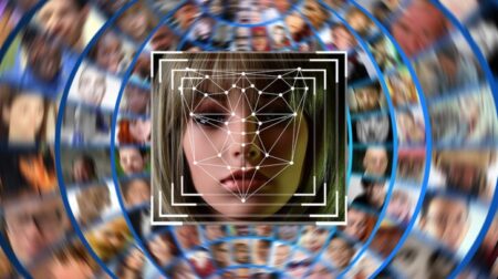 European Data Protection Board rules on use of facial recognition at airports A graphic of a face being biometrically scanned, on a swirling background of other faces.