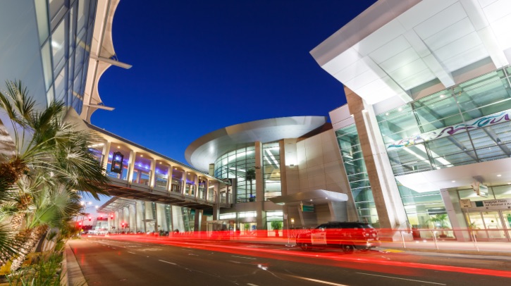 The image shows the outside of San Diego Airport terminal.