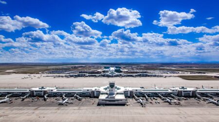 Denver International Airport launches US$1.25m study into nuclear energy An external shot of Denver International Airport (DEN) with teh airport in the foreground, with planes parked up at the gates and the horizon in the distance and a blue sky above this