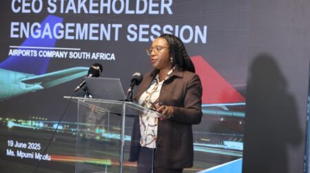 Mpumi Mpofu, CEO of ACSA, speaks in front of a sign that says, "CEO stakeholder engagement session".