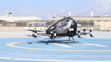 An eVTOL hovers over the ground.