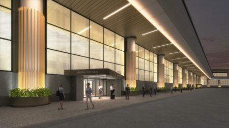 A render of Milan Malpensa Airport's Arrivals façade shows passengers walking around the lit-up terminal at night.