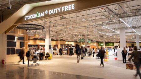 Blurred passengers move through Stockholm Arlanda Airport's new Duty Free area.