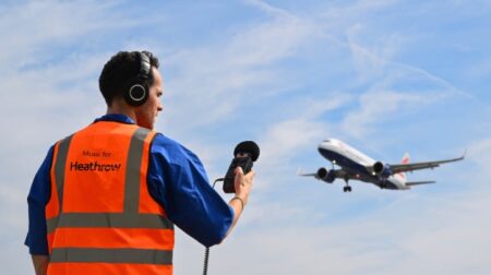 Heathrow launches song created by Grammy nominee entirely from airport sounds Jordan Rakei faces away from the camera, wearing an orange high-vis jacket that says Music for Heathrow, and records a plane taking off.