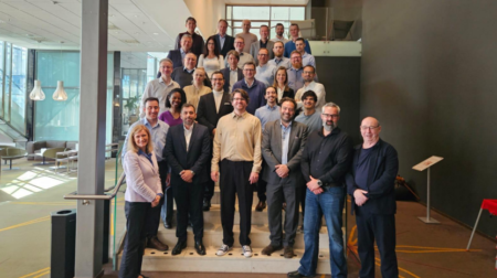 The ACI Europe Cyber Security Committee pose for a photograph on a staircase
