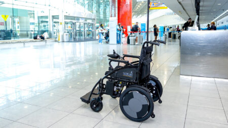 An autonomous wheelchair which his part of a pilot project at Baltimore/Washington International Thurgood Marshall Airport sits on the terminal concourse with departure gates in the background