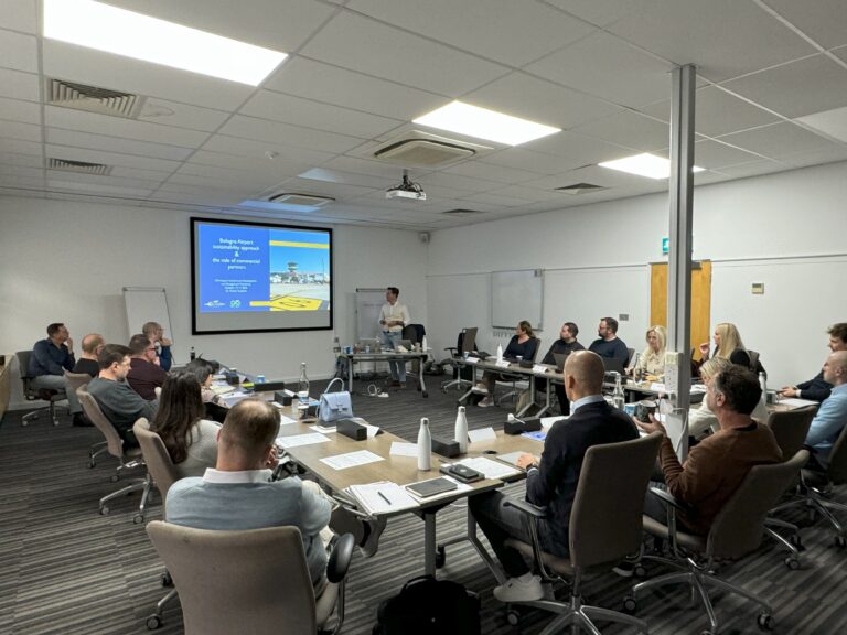 A classroom of aviation professionals attend a training course