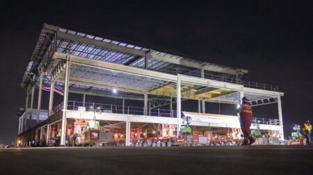 The modules for the Terminal F at DFW airport are moved into place at night, illuminated by strong lights