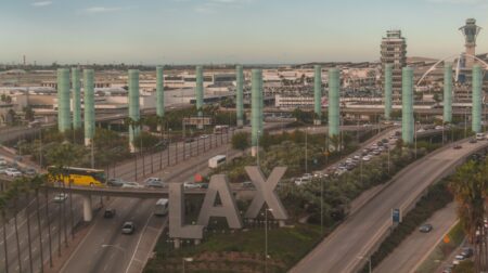 Aerial shot of LAX airport with the iconic "LAX" signage