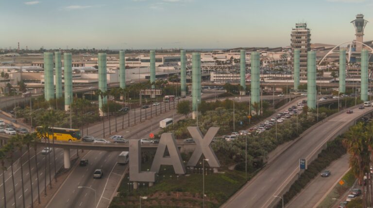 Aerial shot of LAX airport with the iconic "LAX" signage