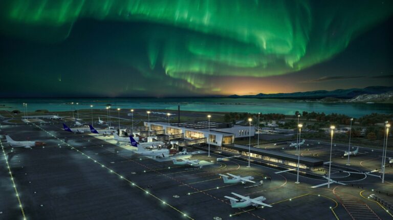 Night view over Bodø Airport in Norway with the Northern Lights in green above