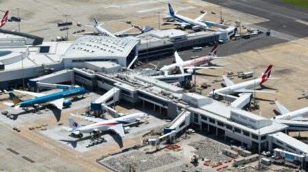 Aeroplanes parked at various gates at an airport