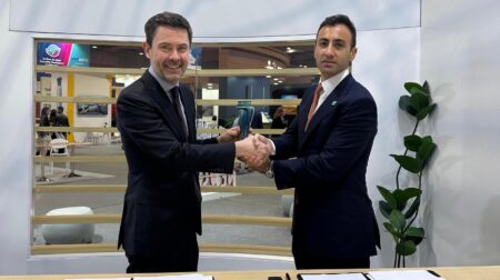 Representatives of Instanbul and Sydney airports shake hands to make the signing of the sister airport agreement