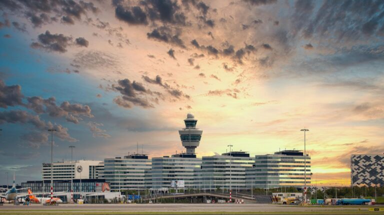 Amsterdam Schipol launches ground handling tender External shot of Amsterdam Airport Schiphol with the sun low in the sky and scattered clouds