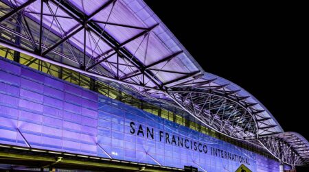 SFO unveils Airport Integrated Operations Center Exterior front of San Francisco International Airport at night.