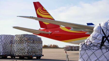 Liege Airport launches first direct scheduled cargo service to Chongqing A Suparna Airlines aircraft on the tarmac at an airport. the tail and wings are in view with ground support vehicles in the foreground.