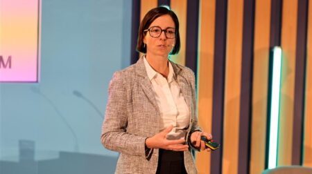 Katrin Hennig, vice president of owner representation for large-scale projects at Munich Airport, speaking at PTE World Conference 2026.