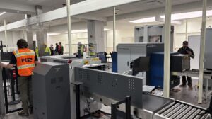 Grey security equipment at Southwest Florida International Airport's Concourse C checkpoint.