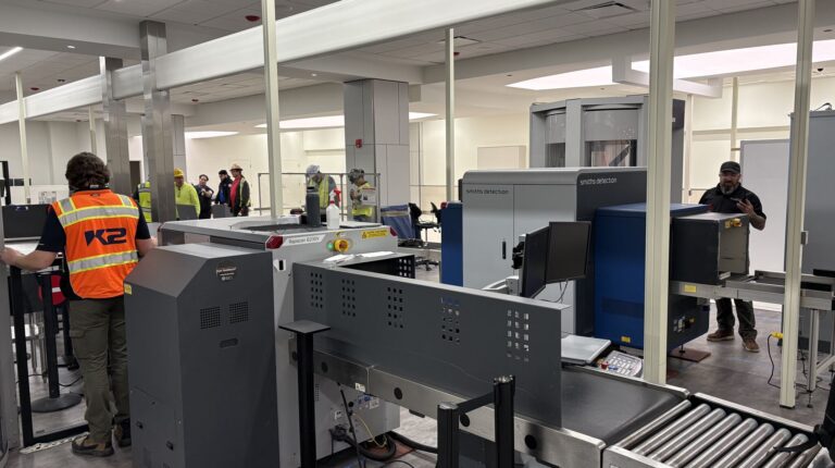 Grey security equipment at Southwest Florida International Airport's Concourse C checkpoint.
