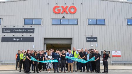 Representatives of GXO Logistics and London Luton Airport cut the ribbon to open the new consolidation center at the London airport.