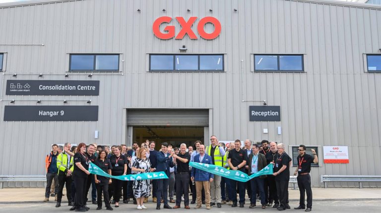Representatives of GXO Logistics and London Luton Airport cut the ribbon to open the new consolidation center at the London airport.