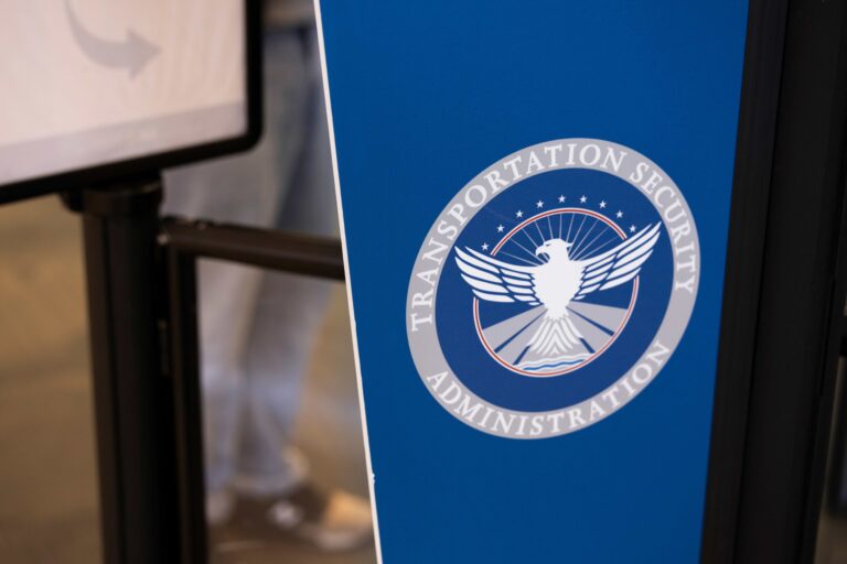 TSA logo on a blue board at an airport.