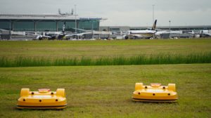 Autonomous robot mowers cutting the grass at Brisbane Airport.