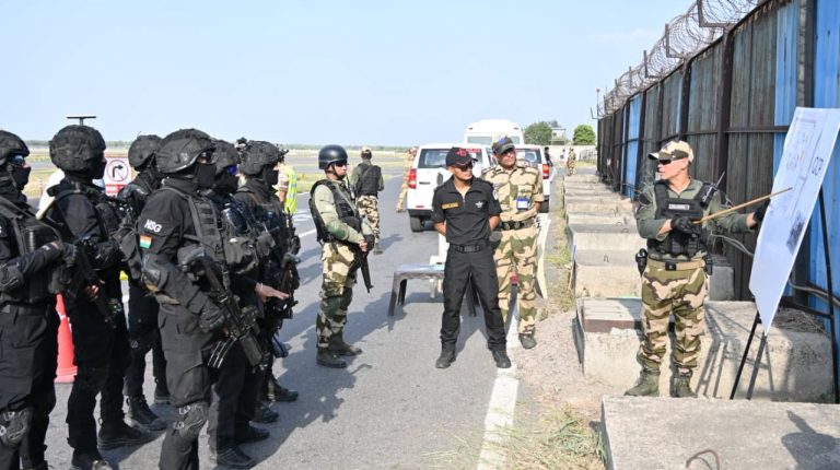 CISF tests security response with mock exercises at Indian airports. Men in camouflage gear carrying guns participate in an exercise.