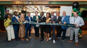 Representatives of MERA, ASUR Airports, American Airlines and the Port Authority of New York and New Jersey attend a ribbon cutting ceremony for Neir’s Tavern at JFK airport.