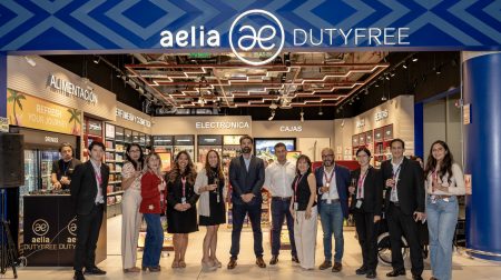 Representatives of Lagardère Travel Retail and Lima's Jorge Chávez Airport stand in front of the new opens last-minute duty free store. Company logos run across the top of the image.