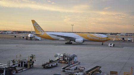 Aviation fuel infrastructure expansion program moves ahead at Perth Airport A white and yellow Scoot airplane taxis across the tarmac at Perth Airport.