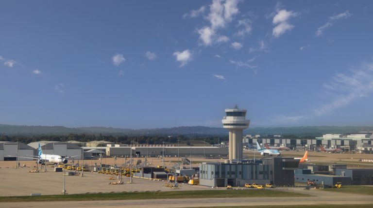 External view of London Gatwick Airport on a bright sunny day.
