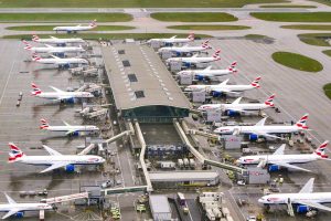 Aerial view of a row of British Airways planes parked at Terminal 5 at Heathrow Airport.
