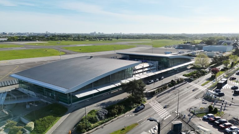 VINCI Airports Aerial view of Rennes airport on a bright sunny day.