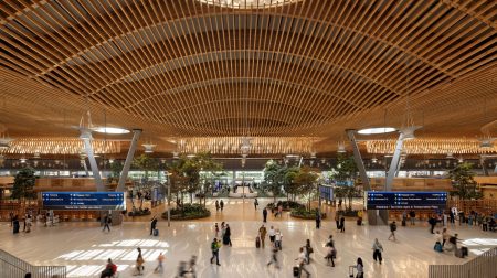 Second and final phase of US$2bn PDX main terminal expansion opens The interior of the second and final phase of US$2bn PDX main terminal expansion. It has a high wooden ceiling, lots of natural light and there are passengers across the concourse.