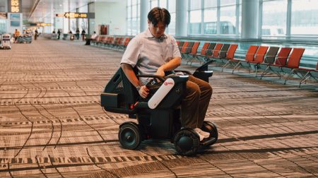Changi rolls out autonomous wheelchairs for passengers with reduced mobility A male passenger sits in an autonomous wheelchair at Changi Airport on a quiet concourse.