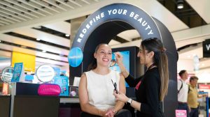 A passenger at Heathrow Airport gets a beauty treatmetn at a pop-up space as part of the airport's Redefine Your Beauty campaign.