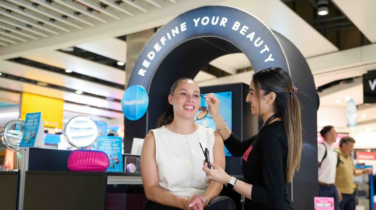 A passenger at Heathrow Airport gets a beauty treatmetn at a pop-up space as part of the airport's Redefine Your Beauty campaign.