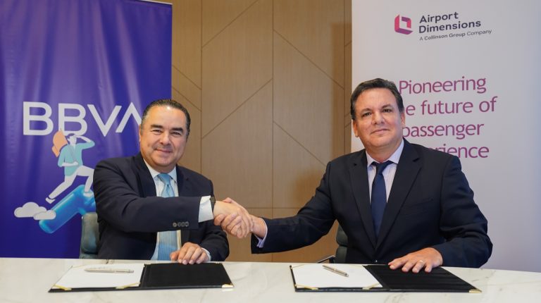 Giorgio Benza, vice president for Latin America at Airport Dimensions, and Fernando Eguiluz, CEO of BBVA in Peru, shake hands to mark the signing of a contract for the opening of the new premium lounge at Lima's Jorge Chávez International Airport (LIM).