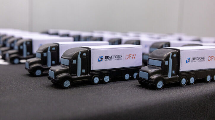 A row of toy Bradford Airport Logistics trucks.